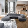 A modern, spacious living room with a large sectional sofa, dining area, and kitchen. Produktbild-Vorschau