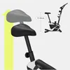 A close-up of a stationary bike seat and a smaller image of the entire bike, with a measurement indicator. Produktbild-Vorschau