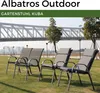 Four outdoor chairs are arranged on a grassy lawn in front of a bridge and city skyline. Produktbild-Vorschau