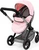 A pink doll stroller with a white star pattern is shown against a white background. Náhled obrázku produktu
