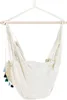 A hanging chair suspended from a wooden bar. Náhled obrázku produktu