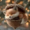 A cute fox ornament is hanging from a Christmas tree, with bokeh lights in the background. Produktbild-Vorschau