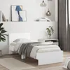A white bed frame with a headboard and bedding is shown in a bedroom setting. Anteprima dell’immagine prodotto