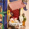 A miniature tea room scene with a table set for tea. Produktbild-Vorschau