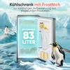 A refrigerator with its door open, showing its contents, set against an icy, arctic-like background with penguins. Produktbild-Vorschau