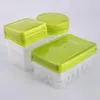 Three stacks of clear plastic food containers with green lids are arranged on a white background. Náhled obrázku produktu