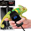 A chameleon is shown on a hand, with a heating mat and thermostat in the background. Voir les images du produit