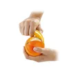 Hands peeling an orange with a peeler. Náhľad obrázku produktu