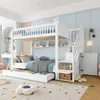A white bunk bed with a pull-out trundle bed in a child's bedroom. Produktbild-Vorschau