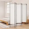 A room divider is set up in a bedroom next to a bed. Náhled obrázku produktu