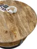 A close-up view of a round wooden coffee table with a metal frame, featuring a pair of white headphones and some papers on its surface. Produktbild-Vorschau