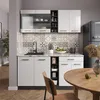 A modern kitchen with white cabinets, a patterned backsplash, and a wooden table. Anteprima dell’immagine prodotto