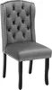 A single gray upholstered dining chair with tufted back and silver nailhead trim, set against a white background. Produktbild-Vorschau