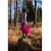 A person stands on a rock in a forest holding a magenta backpack. Anteprima dell’immagine prodotto