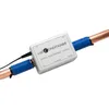 A product shot of an electronic water conditioner attached to copper pipes. Voir les images du produit