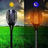 A split image showing a solar torch light in a field during the day and at night. Voir les images du produit