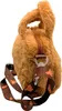 A close-up view of a fluffy brown capybara-shaped handbag with a brown strap adorned with capybara illustrations. Produktbild-Vorschau