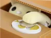 A close-up of a coin bank with a cat's paw reaching out to take a coin. Náhľad obrázku produktu