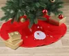 A Christmas tree skirt with Santa Claus and snowflakes, decorated with gift boxes and ornaments. Produktbild-Vorschau