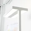 A close-up shot of a modern white LED floor lamp. Produktbild-Vorschau