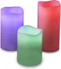 Three LED candles of different colors are displayed against a white background. Produktbild-Vorschau