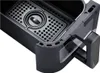 A close-up view of the interior of a black air fryer basket with a perforated tray and a handle. Voir les images du produit