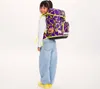 A young girl wearing a backpack. Anteprima dell’immagine prodotto