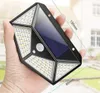 A hand holding a solar-powered LED light with motion and dusk sensors. Produktbild-Vorschau