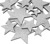A pile of silver glittery star-shaped cutouts on a white background. Produktbild-Vorschau
