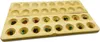 A wooden Mancala board game with colorful stones in the pits, shown on a white background. Produktbild-Vorschau