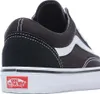 Close-up side view of a black Vans sneaker with a white stripe. Voir les images du produit