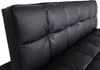 A close-up view of the tufted backrest of a black sofa. Produktbild-Vorschau
