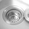 A close-up view of a stainless steel sink drain with a removable strainer basket. Náhled obrázku produktu