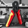 A crimping tool with red and yellow handles is shown in focus against a blurred background of a workshop or tool storage area. Produktbild-Vorschau