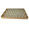 A tray of small glass jars. Produktbild-Vorschau