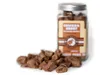 A jar of chicken hearts for pets with some scattered around it. Produktbild-Vorschau