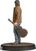 A statue of a man holding a guitar, standing on a wooden platform. Podgląd zdjęcia produktu