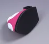 A close-up, angled view of the sole of a pink and white mini iron against a gray background. Produktbild-Vorschau