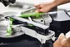 A close-up view of a miter saw with a person's hands operating it. Podgląd zdjęcia produktu