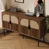 A wooden sideboard with four doors is shown in a room setting, with decorative items on top. Anteprima dell’immagine prodotto