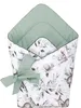 A baby nest or cocoon with a woodland animal and leaf pattern, tied with a green ribbon. Náhled obrázku produktu
