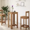 A wooden bar table and two bar stools are set up in a room with a large potted plant and shelves on the wall. Anteprima dell’immagine prodotto