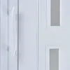 A close-up view of a white door handle and part of a white door with window panels. Podgląd zdjęcia produktu