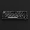 A black mechanical keyboard is shown from a slightly elevated front-facing angle against a plain black background. Produktbild-Vorschau