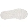 The bottom view of a white sneaker sole. Voir les images du produit