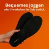 Schwarze Einlegesohlen mit strukturierter Fußgewölbeunterstützung, von einer Hand gegen orangefarbenen Hintergrund mit weißem Text gehalten Produktbild-Vorschau