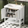A white bathroom vanity with a sink and faucet, open doors revealing shelves with toiletries. Voir les images du produit