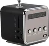 A close-up, angled view of a small, cube-shaped portable radio with a digital display and buttons. Náhľad obrázku produktu
