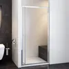 A modern bathroom with a shower enclosure, toilet, and toilet brush holder. Produktbild-Vorschau