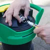 Hands connecting a hose to a cleaning device. Produktbild-Vorschau